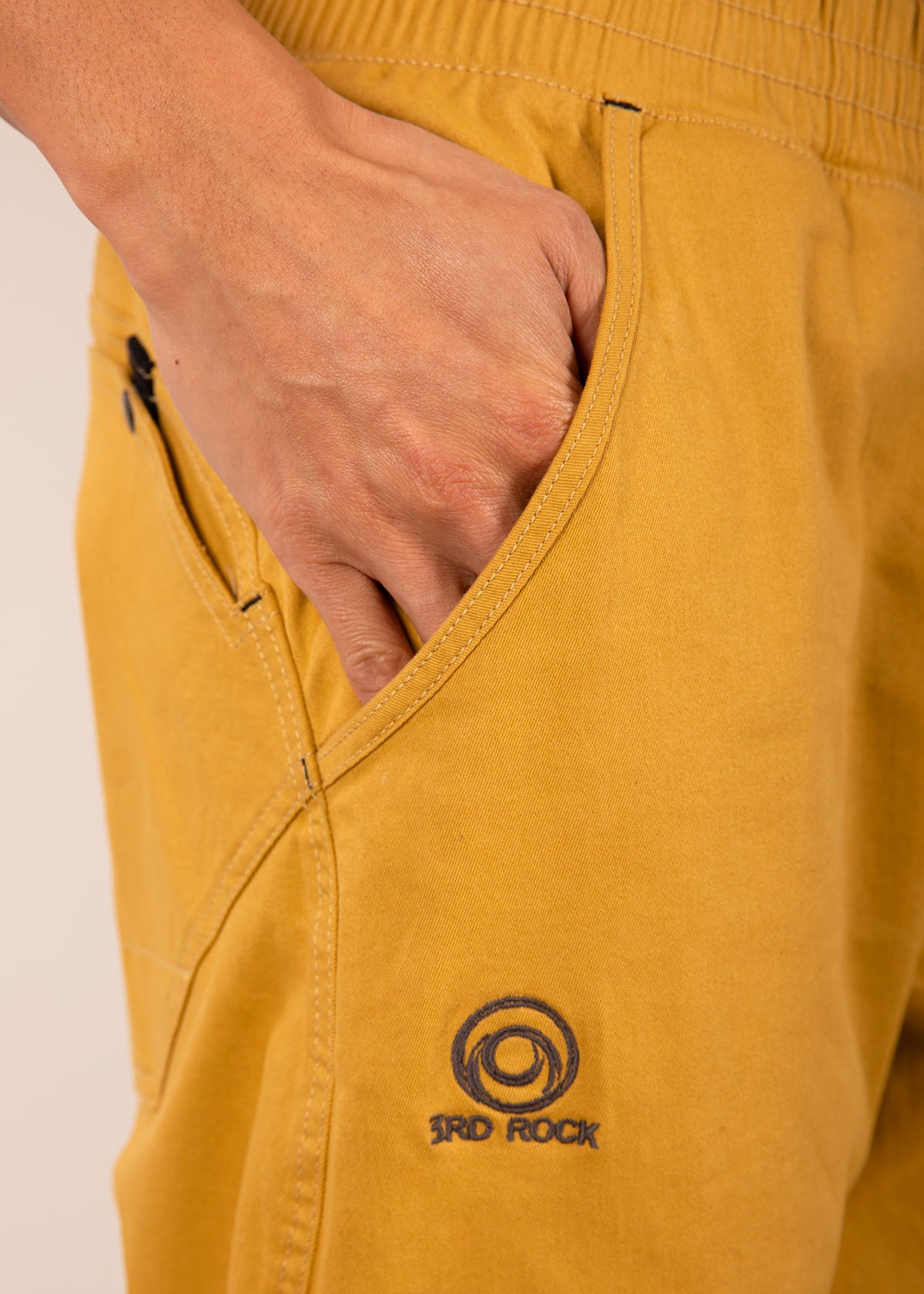 A close up showing our embroidered logo on our nova trousers